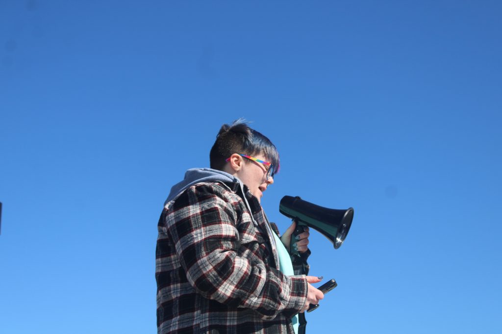 a student speaks through a megaphone